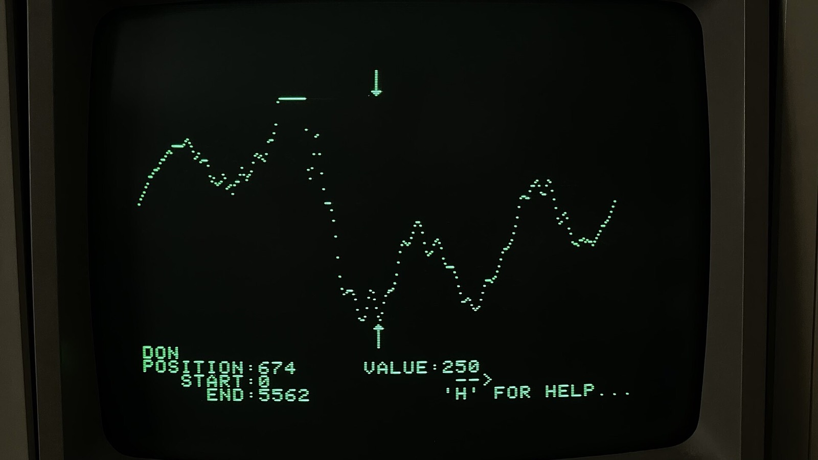 A green waveform display running on a 1980s Apple II music program