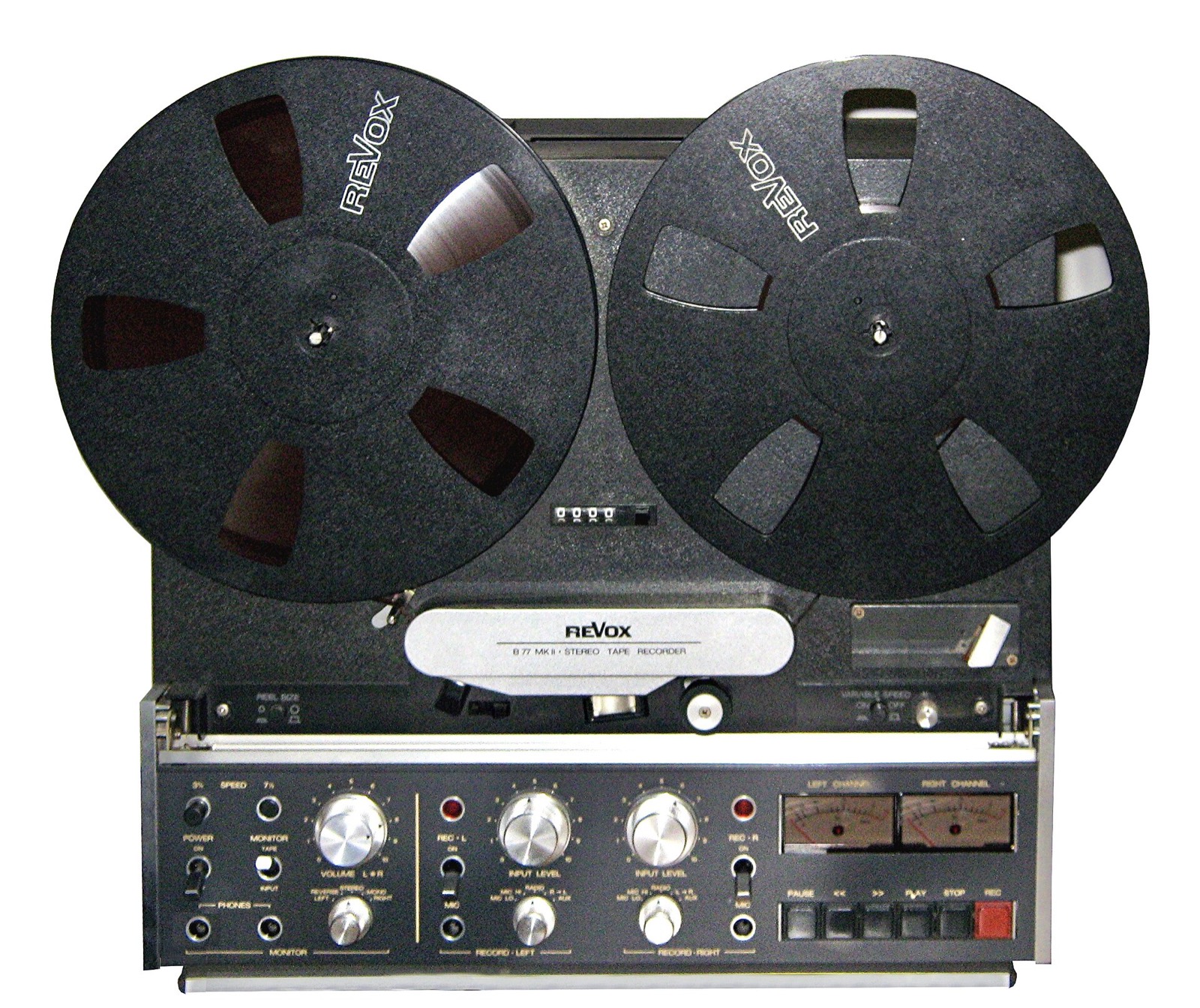 A Revox reel-to-reel tape machine with two reels and a row of transport keys